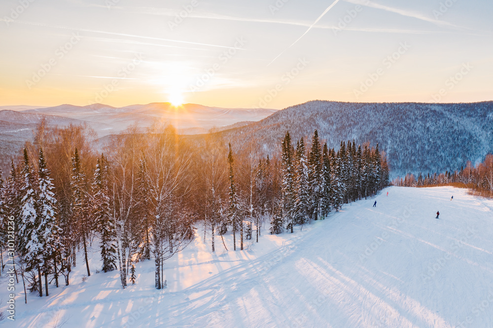 Sunset on a winter ski slope Sunset on a winter ski slope
