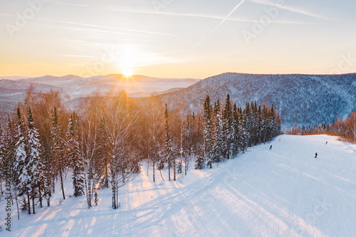 Sunset on a winter ski slope © Tatiana