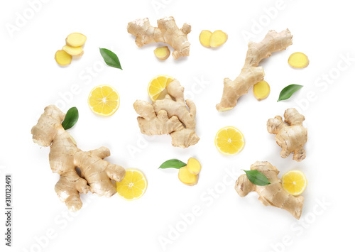 Slices of fresh ginger with lemon on white background