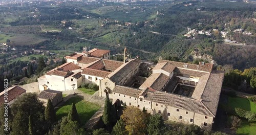 Orbit aerial view of Saint Francis San Francesco ancient medieval christian monastery. Fiesole hills near Florence, Tuscany Italy