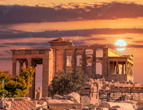 Athens Acropolis Greece, Caryatids statues standing on Erechtheum ancient temple under dramatic magic hour sky