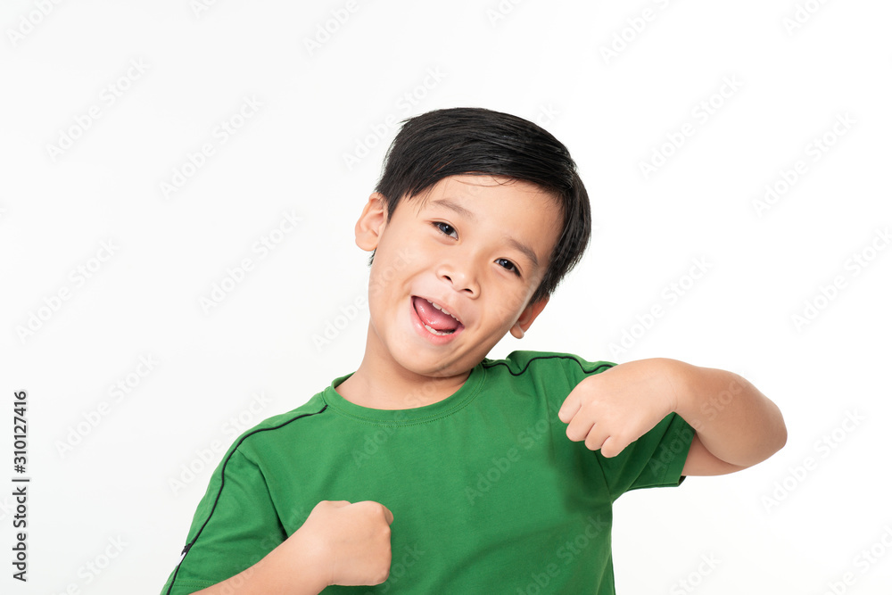 Portrait of cute smart young Asian boy shows winning gesture and smiling at camera, celebrating success victory against white background Portrait of cute smart young Asian boy shows winning gesture and smiling at camera, celebrating success victory against white background