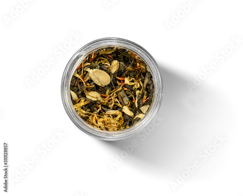 Green tea with aromatic additives. Top view on white background