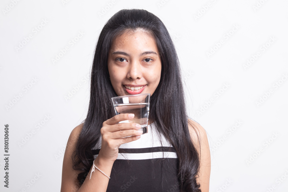 Young Asian woman with a glass of drinking water Young Asian woman with a glass of drinking water
