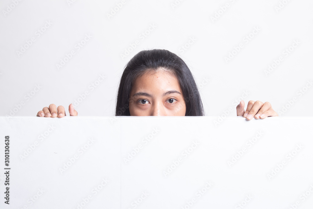 Close up of young Asian woman behind a blank sign Close up of young Asian woman behind a blank sign