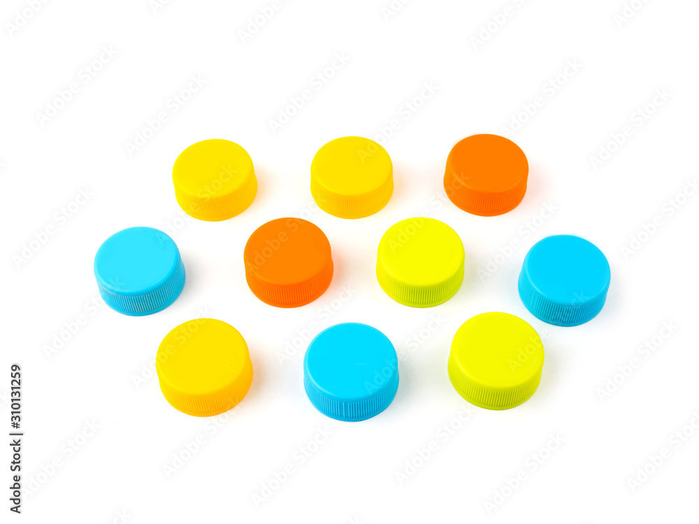 Colorful plastic bottle caps on white background. selective focus Colorful plastic bottle caps on white background. selective focus