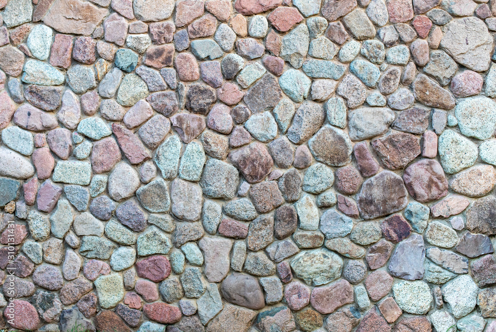 The texture of the stone wall. Pattern of design decorative real stone wall surface with cement. Natural background of rock wall. The texture of the stone wall. Pattern of design decorative real stone wall surface with cement. Natural background of rock wall.