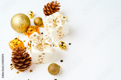 christmas golden background, christmas decoration, cones, balls, glitter, flat lay