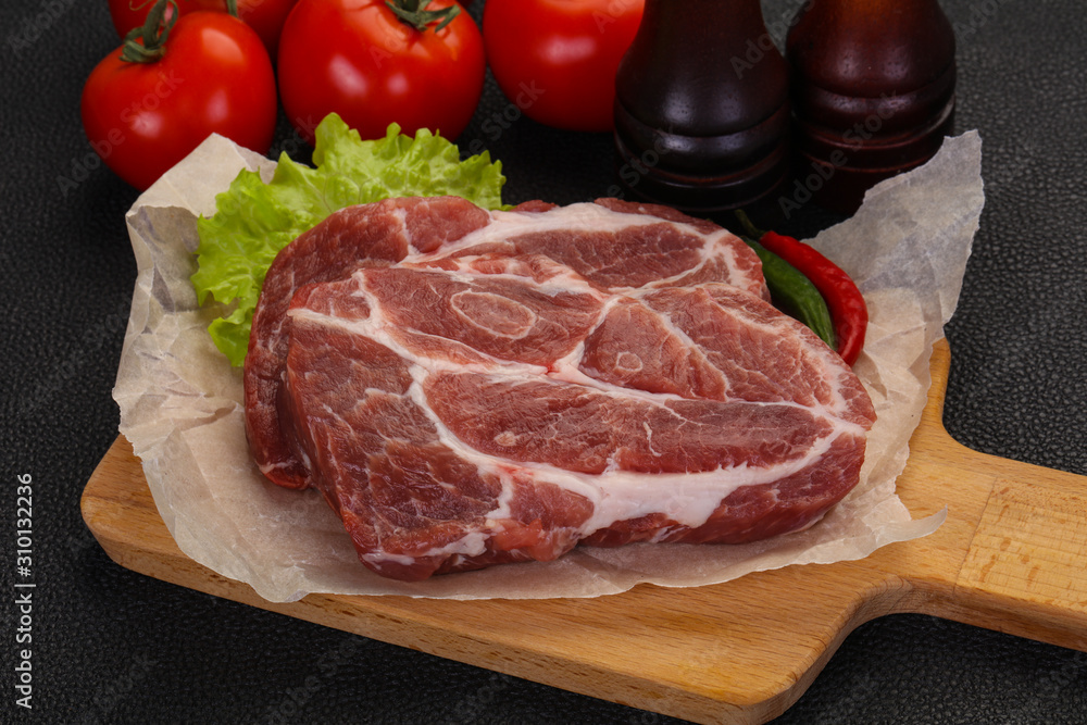 Raw pork neck steak