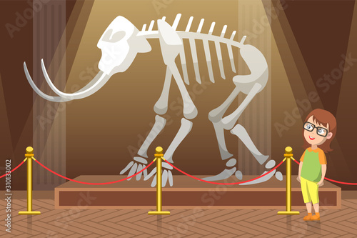 Boy in natural history museum. Exhibition with skeleton of mammoth with big white tusks and bones. Kid in glasses amazed by prehistoric animal. Child alone in hall. Flat cartoon vector illustration