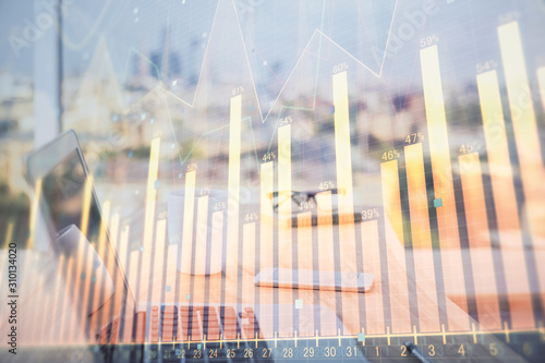 Forex Chart hologram on table with computer background. Multi exposure. Concept of financial markets.