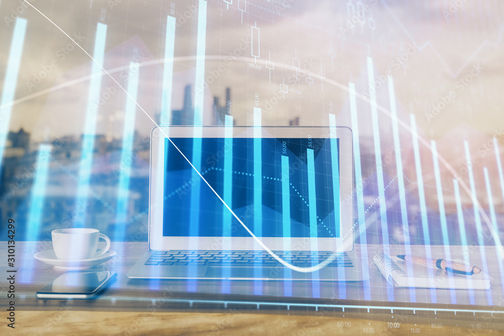 Forex Chart hologram on table with computer background. Multi exposure. Concept of financial markets. Forex Chart hologram on table with computer background. Multi exposure. Concept of financial markets.
