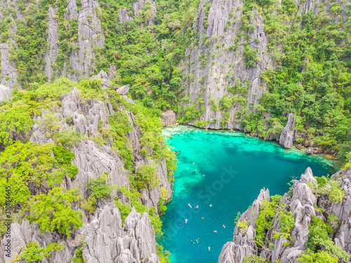 Aerial view of Twin Lagoon on paradise island with sharp limestone rocks  tropical travel destination - Coron  Palawan  Philippines.