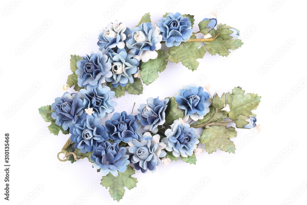 Obraz premium Blue colorful textile rose on white background