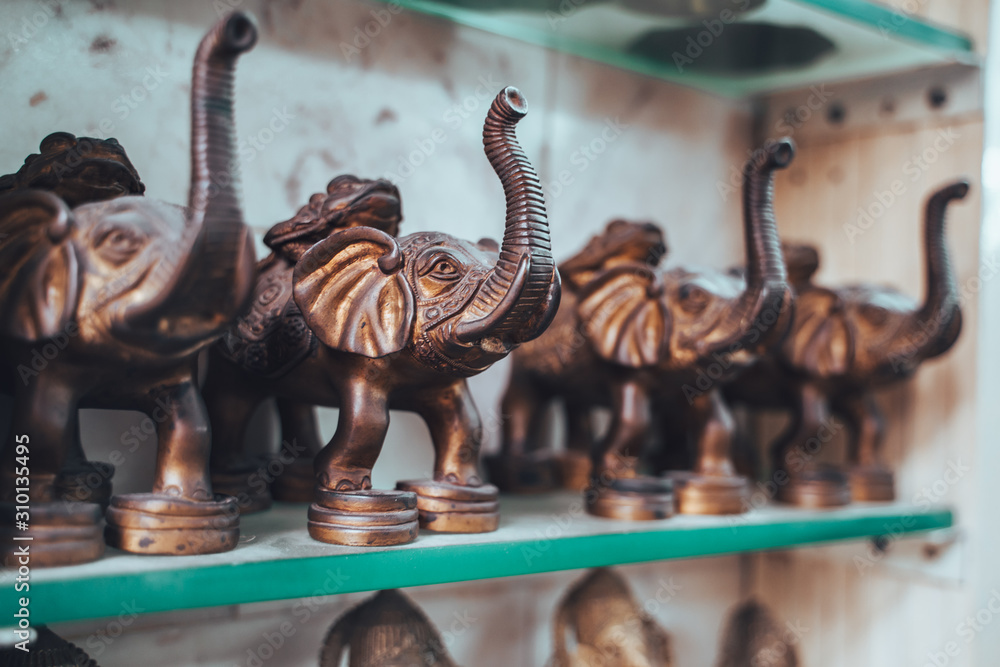 Bronze brass elephant statues for sale in Old Delhi. Selective focus on one statue Bronze brass elephant statues for sale in Old Delhi. Selective focus on one statue