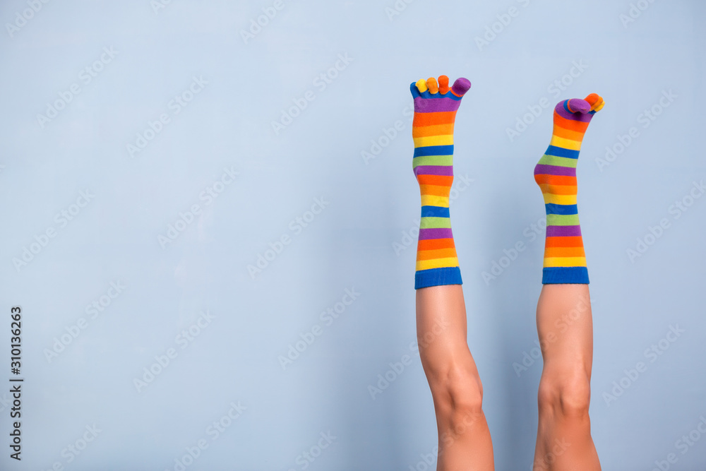 Legs in funny socks on blue backgroundt Legs in funny socks on blue backgroundt