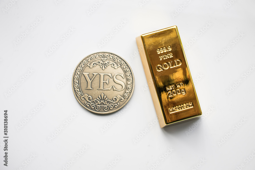 Gold on the table with a Coin Gold on the table with a Coin