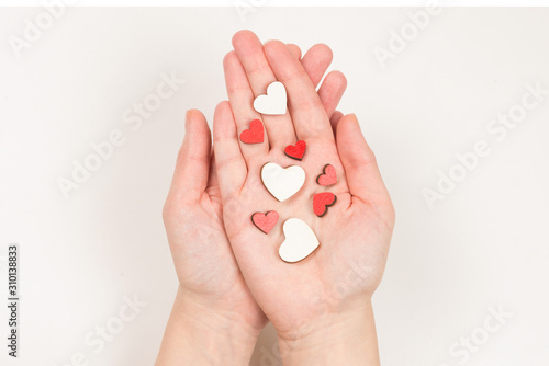 Red heart in woman hand isolated.