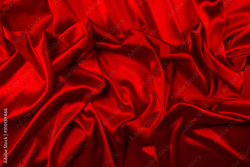 Red silk or satin luxury fabric texture can use as abstract background. Top view. Red silk or satin luxury fabric texture can use as abstract background. Top view.