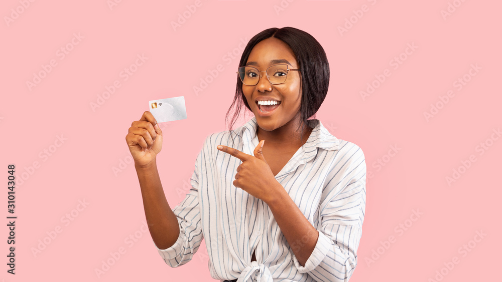 Positive Black Girl Showing Credit Card Standing, Pink Background, Panorama Positive Black Girl Showing Credit Card Standing, Pink Background, Panorama