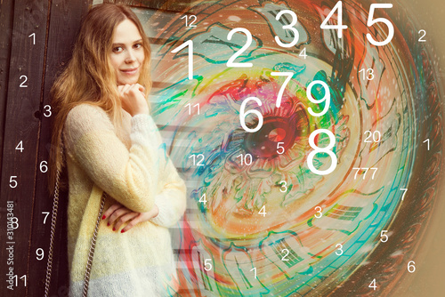 Woman numerologist smiles, numbers and time photo