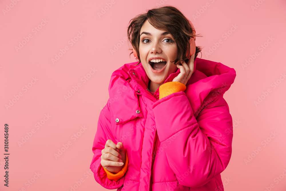Portrait of young excited woman using headphones and smiling Portrait of young excited woman using headphones and smiling