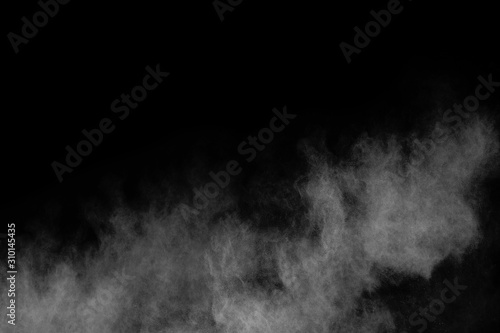 White powder explosion on black background.