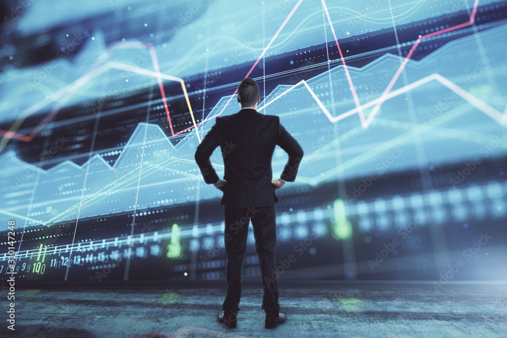 Obraz premium Businessman and forex graph hologram. Double exposure. Concept of financial education and analysis