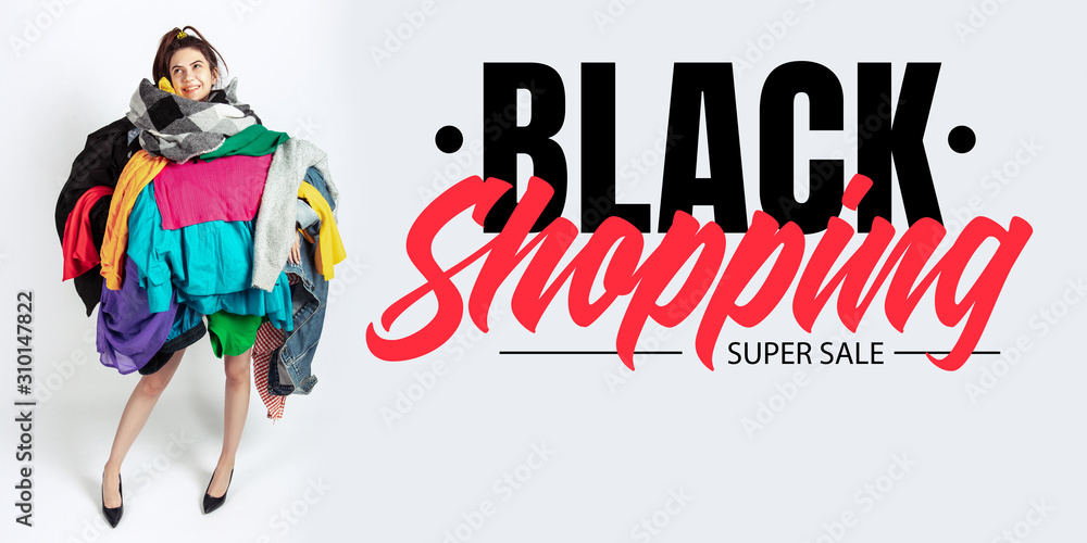 Black shopping, finance concept. Woman addicted of sales and clothes. Female model wearing too much colorful clothes. Fashion, style, black friday, sale, purchases, money, online buying. Flyer for ad.