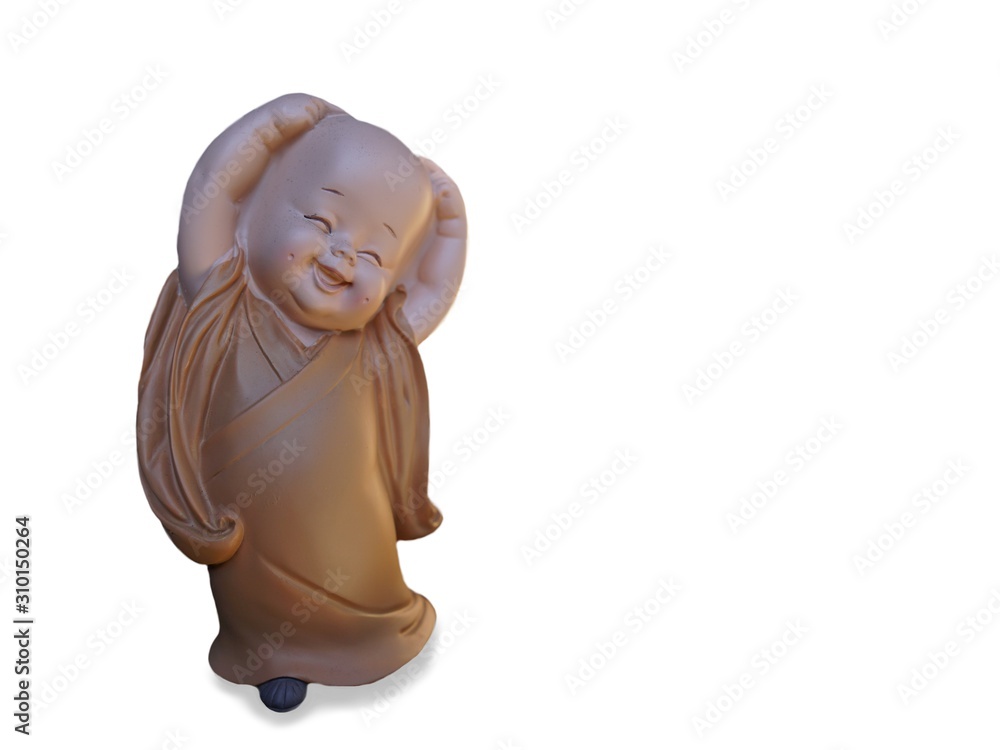 Happy buddhism neophyte clay doll isolate on white background. Happy buddhism neophyte clay doll isolate on white background.