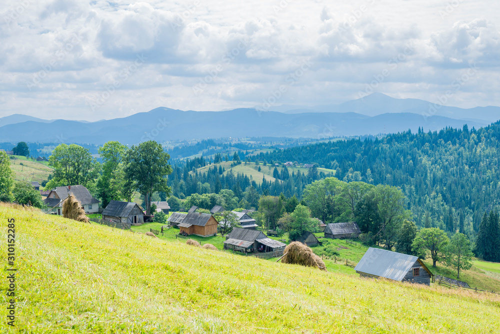 Obraz premium Mountain valley village landscape summer. Mountain village view. Village in mountains. Mountain valley village landscape