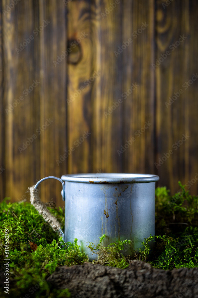 Obraz premium Vintage coffee mug in moss