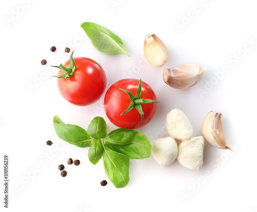 Ripe red cherry tomatos and mozzarella isolated on white background. Top view