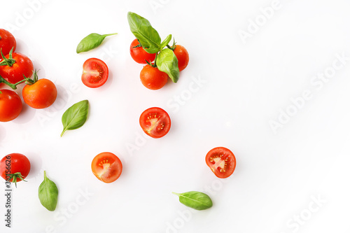 Red ripe cherry tomatoes on white background. Top view