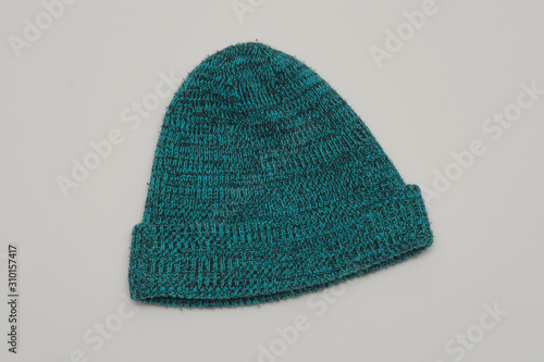blue knitted winter hat on a white background