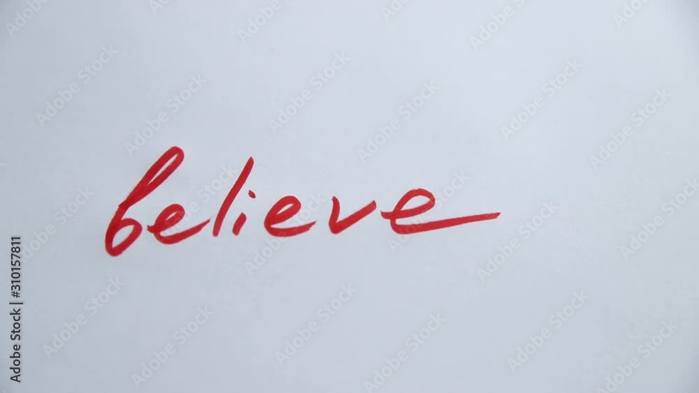 Hand writing Believe on white paper Hand writing Believe on white paper