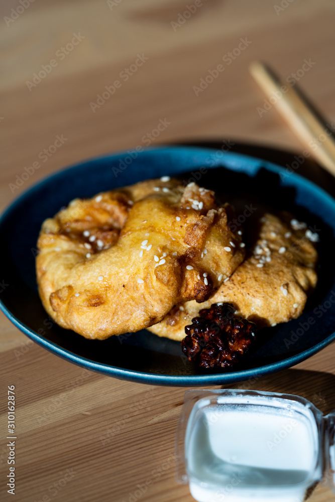 Fried Pineapple Fritters Caramelized with Cinnamon and Sesame Seeds.