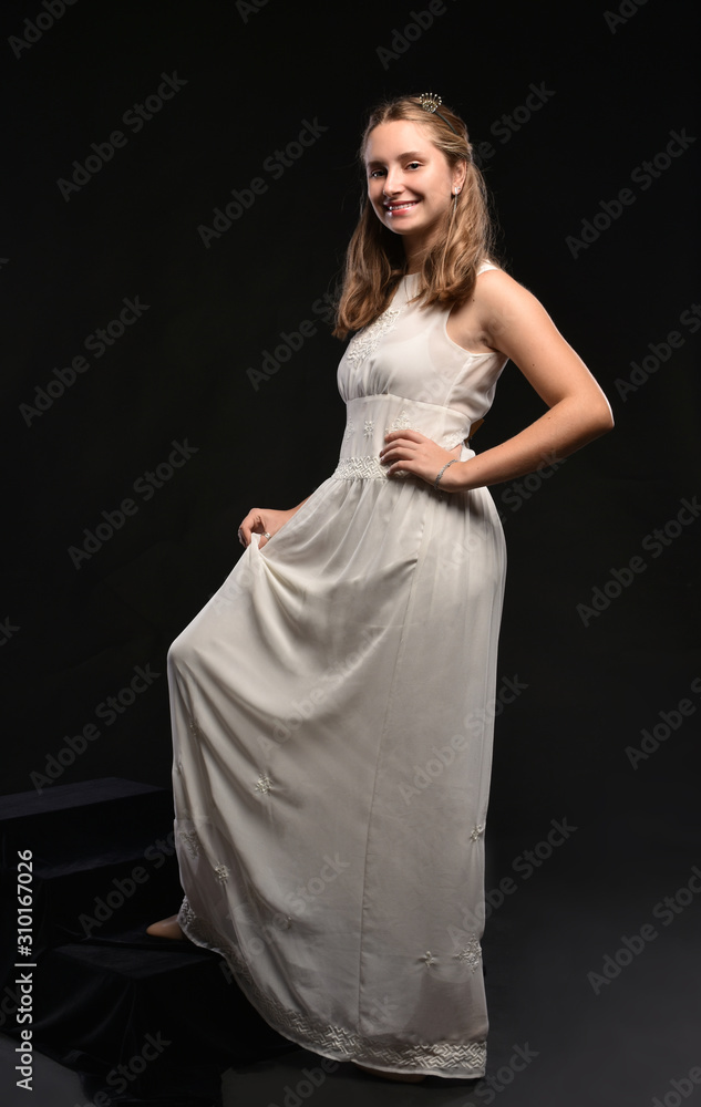 Beautiful  blonde teen girl in white dress