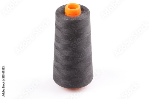 bobbin with black thread isolated on a white background