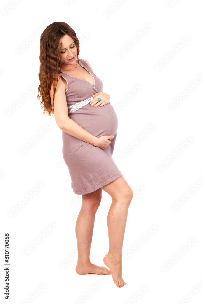 Adorable barefoot pregnant woman isolated on white Adorable barefoot pregnant woman isolated on white