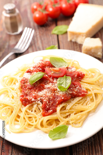 spaghetti with tomato sauce, parmesan and basil