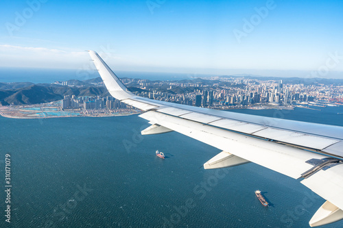 airplane with dalian city skyline