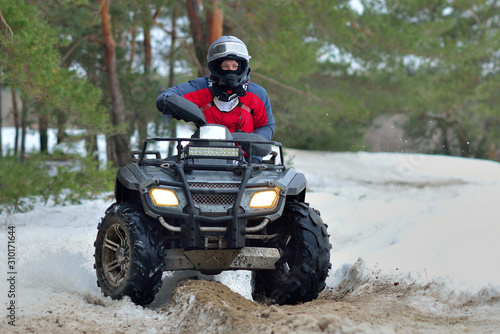 ATV and UTV driving in mud and snow at winter. Extreme, adrenalin. 4x4.