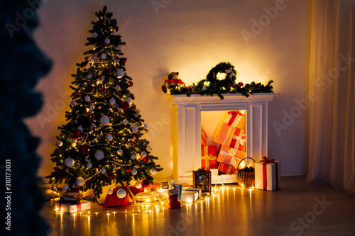 Christmas tree with lights light Garland and gifts for the new year