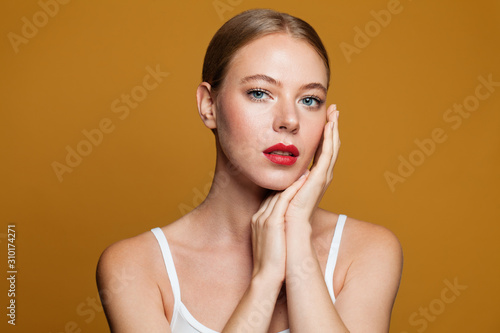 Beautiful girl face on yellow background