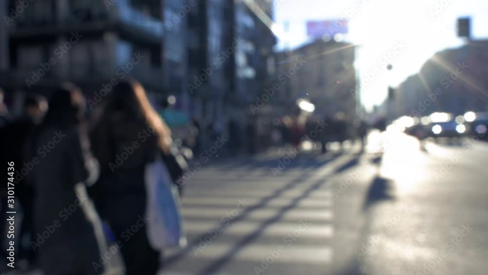 Blurred crowd anonymous people walking on crosswalk city street Blurred crowd anonymous people walking on crosswalk city street