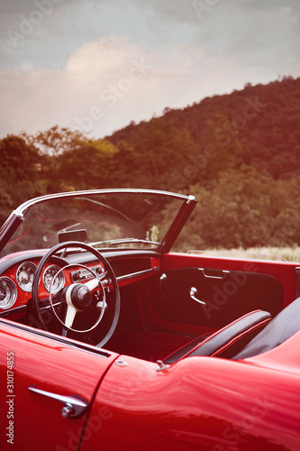 Red Classic Car in the countryside
