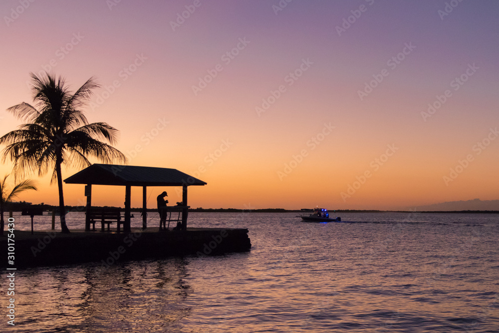 Fisherman on the pier at sunset, Key Largo, Florida