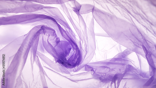 Purple plastic bag swirl pattern over white background