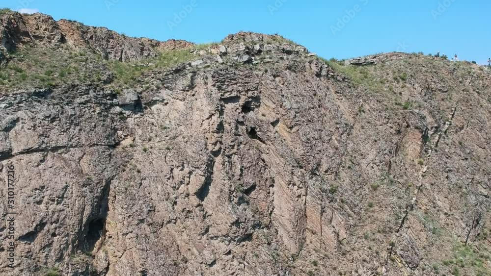 The North Cape of the island Olkhon, lake Baikal, Russia. Video from the air. Drone flies elevating the cliff. The North Cape of the island Olkhon, lake Baikal, Russia. Video from the air. Drone flies elevating the cliff.